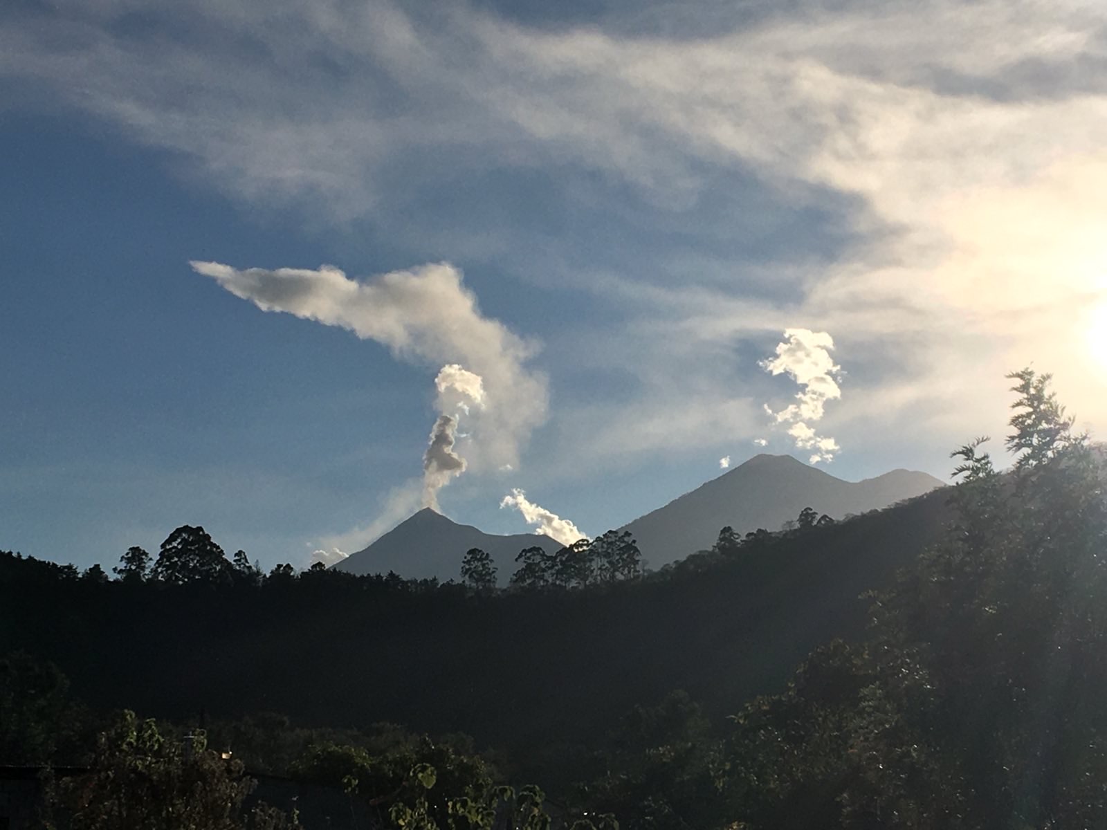 Smoking volcanoes in Guatemala seen from a distance