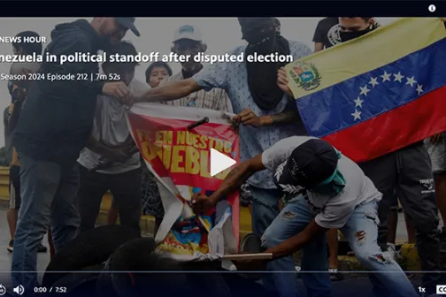 Protesters with a Venezuelan flag in a PBS News Hour segment