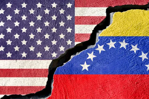 The U.S. and Venezuelan flags cracked apart, showing division